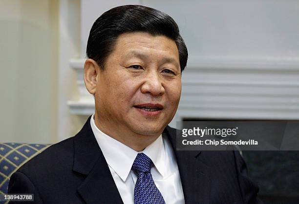 Chinese Vice President Xi Jinping makes brief remarks before an expanded bilateral meeting with U.S. Vice President Joe Biden and other U.S. And...