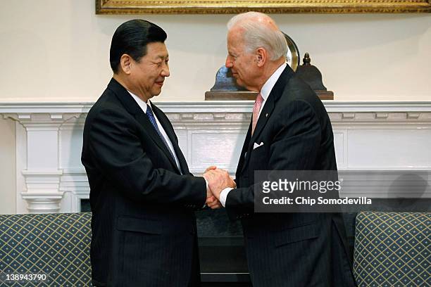 Vice President Joe Biden and Chinese Vice President Xi Jinping shake hands before an expanded bilateral meeting with other U.S. And Chinese officials...