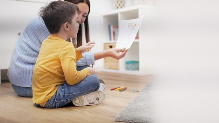 https://media.gettyimages.com/id/1389444880/video/child-therapist-helping-kid-to-understand-family-problem-using-drawing-picture-of-his-parents.jpg?b=1&s=640x640&k=20&c=z5nHgPpDYBy-U_bbSJNQogc_-fidTtmzeEEHaBU46Lc=