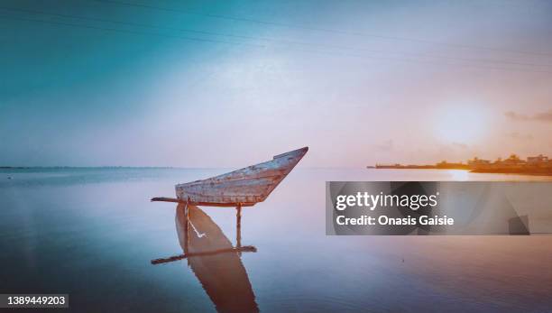 a docked canoe - ghana stock pictures, royalty-free photos & images