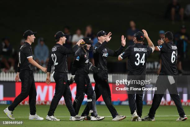 Michael Bracewell of New Zealand celebrates a catch during the third and final one-day international cricket match between the New Zealand and the...