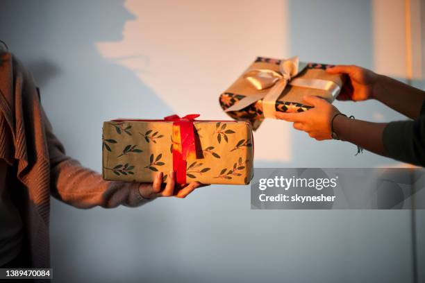 exchanging gifts! - exchanging gifts stock pictures, royalty-free photos & images