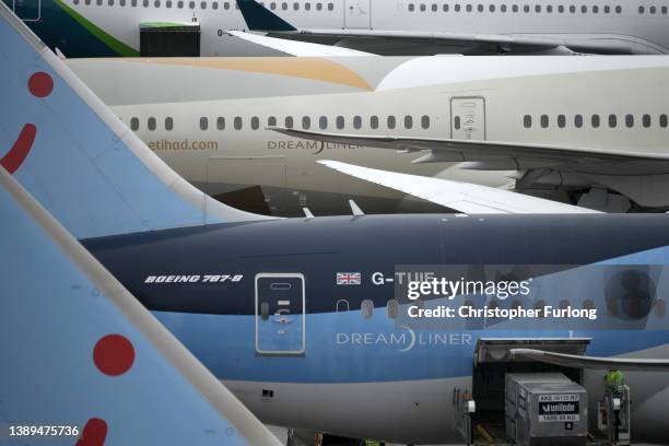 Passenger aircraft wait at the gates at Manchester Airport on April 04, 2022 in Manchester, United Kingdom. Covid checks, high passenger volumes and...