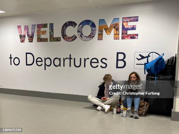 Passengers queue for check in at Manchester Airport's terminal 1 on April 04, 2022 in Manchester, United Kingdom. Covid checks, high passenger...
