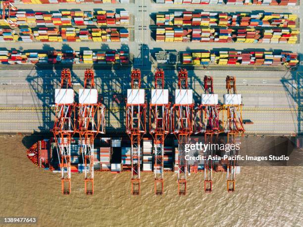 top view of yangshan harbor,  cargo ship and containers in shanghai. - docklands studio stock pictures, royalty-free photos & images
