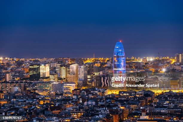 barcelona skyline with modern office buildings at night, catalonia, spain - barcelona skyline stock pictures, royalty-free photos & images