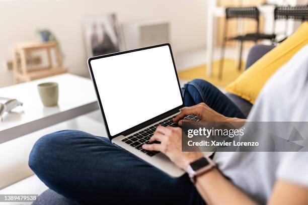 woman working on laptop computer at home - mature woman screen stock pictures, royalty-free photos & images