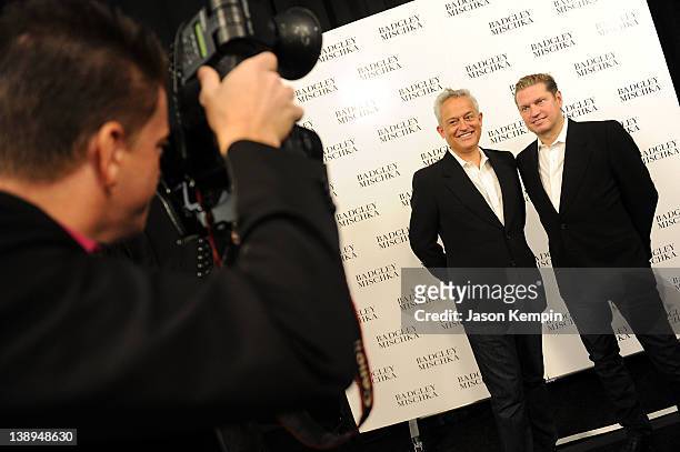 Designers Mark Badgley and James Mischka pose backstage at the Badgley Mischka Fall 2012 fashion show during Mercedes-Benz Fashion Week at The...