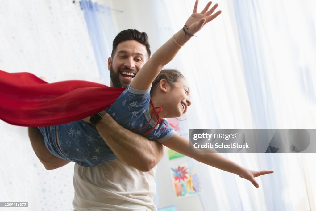 Father and daughter playing together