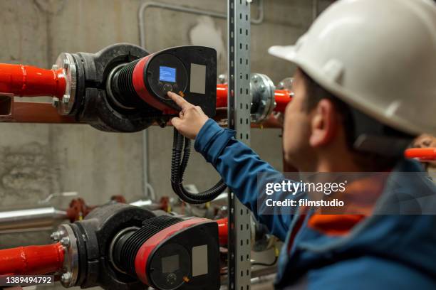 stationary engineer at inspection in boiler room - heating engineer stock pictures, royalty-free photos & images