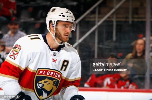 Jonathan Huberdeau of the Florida Panthers skates against the New Jersey Devils at the Prudential Center on April 02, 2022 in Newark, New Jersey.