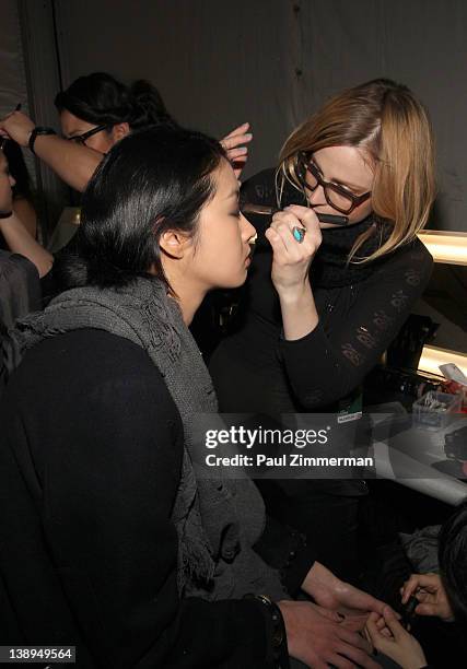 Amodel backstage at the Badgley Mischka Fall 2012 fashion show during Mercedes-Benz Fashion Week at the The Theatre at Lincoln Center on February 14,...