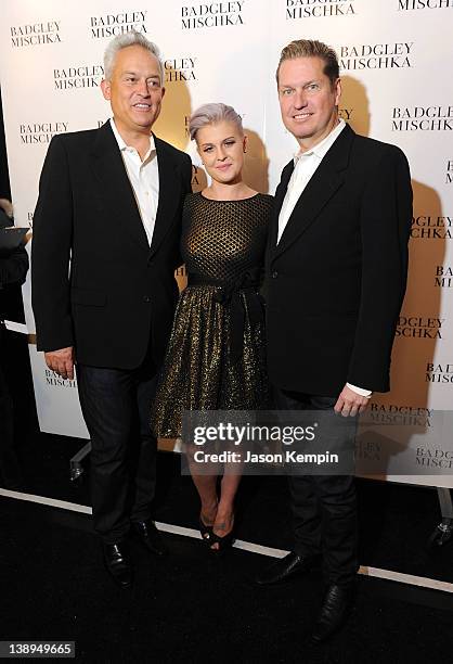 Designer Mark Badgley, Kelly Osbourne and designer James Mischka pose backstage at the Badgley Mischka Fall 2012 fashion show during Mercedes-Benz...