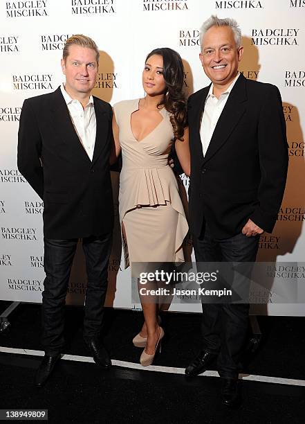 Designer James Mischka, actress Shay Mitchell and designer Mark Badgley pose backstage at the Badgley Mischka Fall 2012 fashion show during...