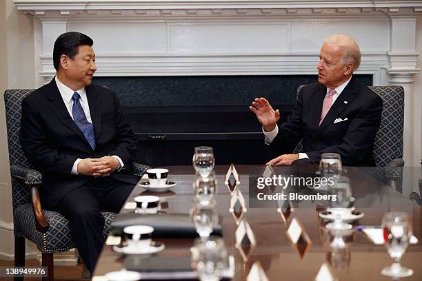 Xi Jinping, vice president of China, left, meets with U.S. Vice President Joe Biden in the Roosevelt Room at the White House in Washington, D.C.,...