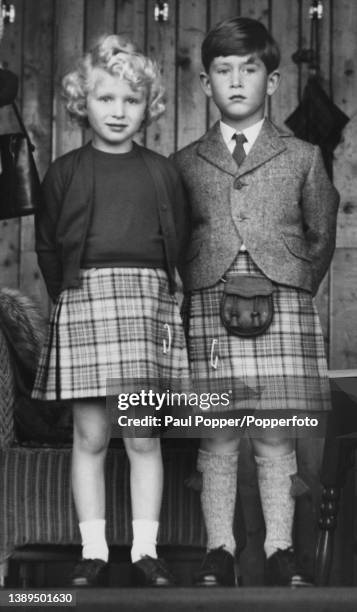 Wearing matching Balmoral tartan kilts, Prince Charles and Princess Anne of Edinburgh, the royal children of Queen Elizabeth II and Prince Philip,...