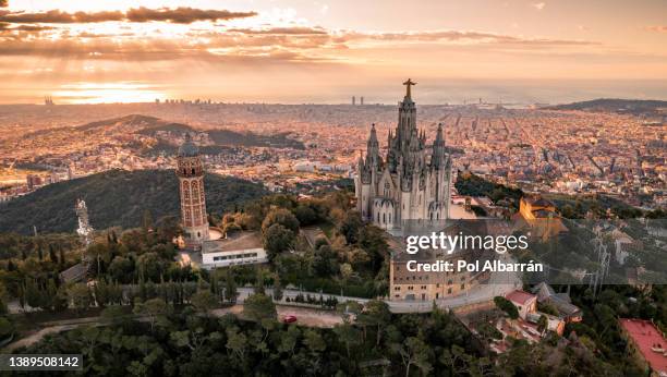 aerial view of barcelona skyline with sagrat cor temple during sunrise, catalonia, spain - unesco gruppo organizzato foto e immagini stock