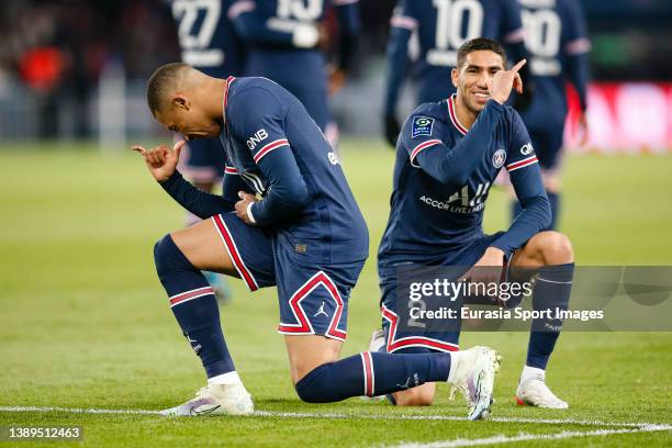 Kylian Mbappe of Paris Saint Germain celebrates his goal with his teammate Achraf Hakimi during the Ligue 1 Uber Eats match between Paris Saint...