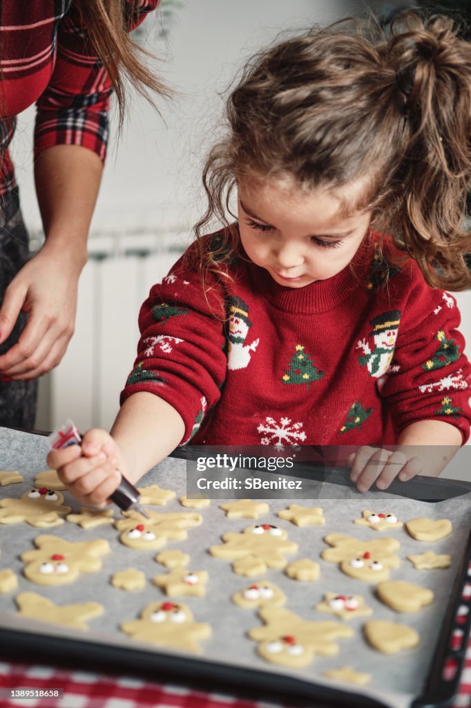 A child making some Christmas cookies