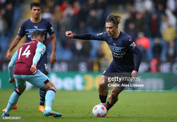 Jack Grealish of Manchester City takes on Connor Roberts of Burnley during the Premier League match between Burnley and Manchester City at Turf Moor...