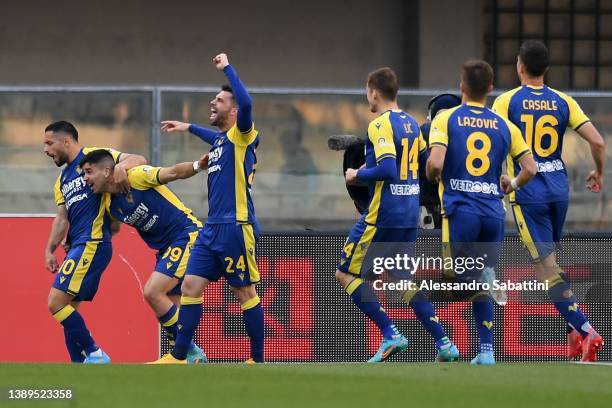 Giovanni Simeone of Hellas Verona celebrates after scoring the opening goal during the Serie A match between Hellas and Genoa CFC at Stadio...