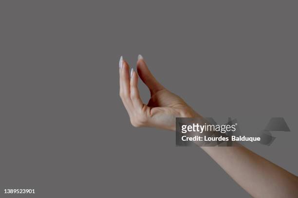 woman hand isolated - stretching fingers stock-fotos und bilder