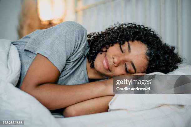 teenager sleeping in bed - girl in her bed stock pictures, royalty-free photos & images