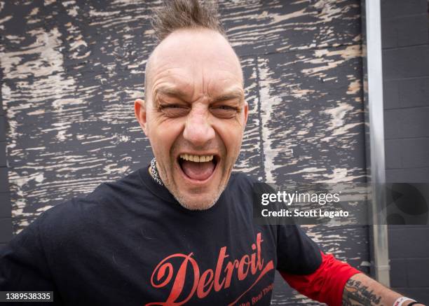 Detroit Red Wings hockey legend Darren McCarty poses at Rustbelt Studio with his rock band Grinder on April 03, 2022 in Royal Oak, Michigan.