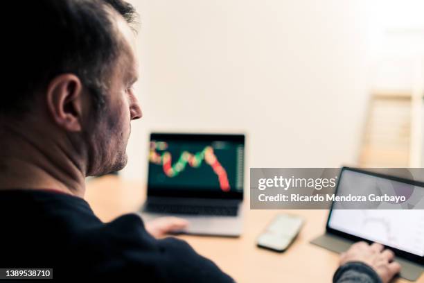 sad man observing declining value - degeneration stock pictures, royalty-free photos & images