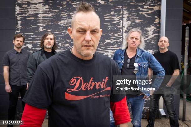 Steve Stetson, Greg Byer, Detroit Red Wings hockey legend Darren McCarty, Billy Reedy and Vince Mattias of the Detroit rock band Grinder pose at...