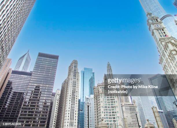 scraping the sky in chicago - michigan avenue stock pictures, royalty-free photos & images