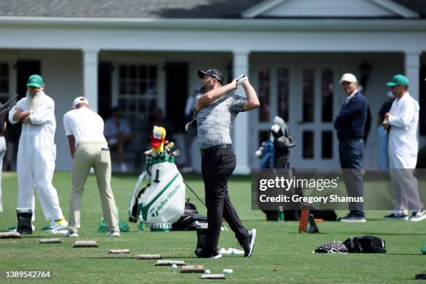 Jon Rahm of Spain hits on the driving range ahead of a practice round prior to the Masters at Augusta National Golf Club on April 04, 2022 in...