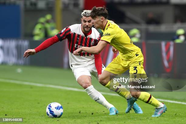 Aaron Hickey of Bologna battles for possession with Theo Hernandez of AC Milan during the Serie A match between AC Milan and Bologna FC at Stadio...