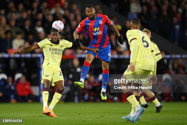 Nuno Tavares of Arsenal competes for a header with Jordan Ayew of Crystal Palace during the Premier League match between Crystal Palace and Arsenal...