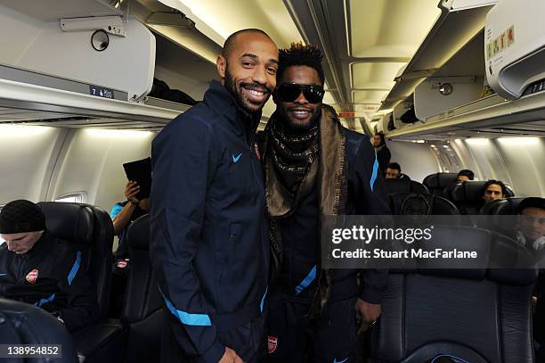 Thierry Henry and Alex Song of Arsenal pose together on the plane at Luton Airport as they travel to Milan ahead of their UEFA Champions League Group...