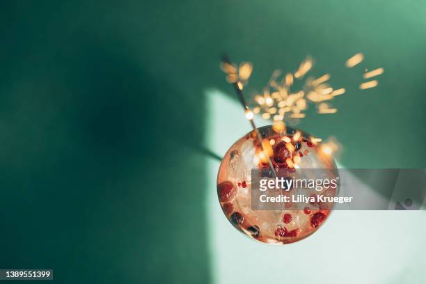 summer drink with berries, ice and sparklers. - lime overhead stock pictures, royalty-free photos & images