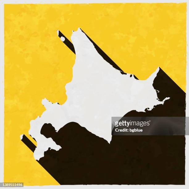 stockillustraties, clipart, cartoons en iconen met hokkaido map with long shadow on textured yellow background - hokkaido