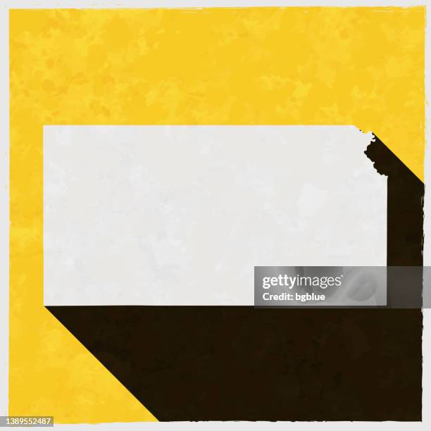 stockillustraties, clipart, cartoons en iconen met kansas map with long shadow on textured yellow background - kansas