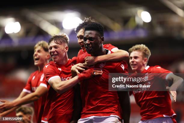 Detlef Esapa Osong celebrates after scoring their team's third goal during the FA Youth Cup Semi Final match between Nottingham Forest U18 and...