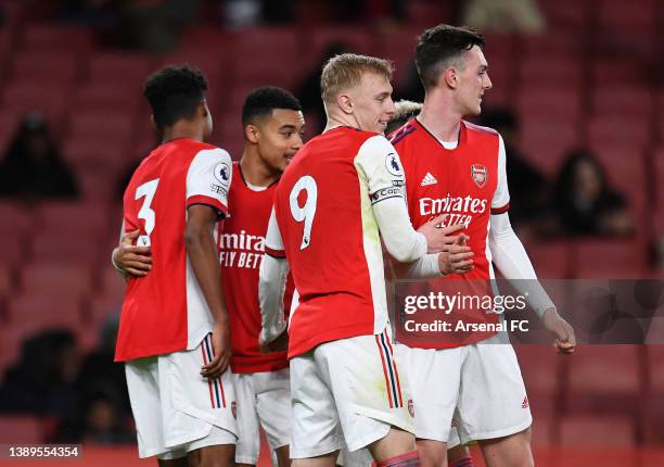 Mika Biereth of Arsenal celebrates with Alex Kirk and teammates after scoring their team's third goal during the Premier League 2 match between...