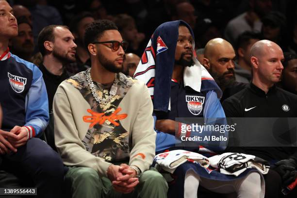 Ben Simmons and Kevin Durant of the Brooklyn Nets look on during their game against the Milwaukee Bucks at Barclays Center on March 31, 2022 in New...