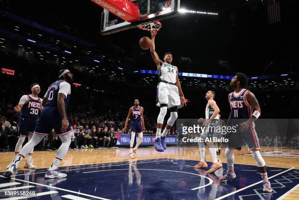 Giannis Antetokounmpo of the Milwaukee Bucks dunks against the Brooklyn Nets during their game at Barclays Center on March 31, 2022 in New York City....