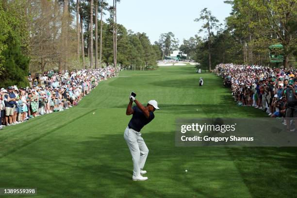 Tiger Woods of the United States plays his shot from the seventh tee during a practice round prior to the Masters at Augusta National Golf Club on...