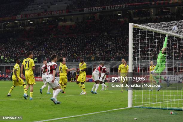 Lukasz Skorupski of Bologna FC tips a header from Ante Rebic of AC Milan over the crossbar during the Serie A match between AC Milan and Bologna FC...