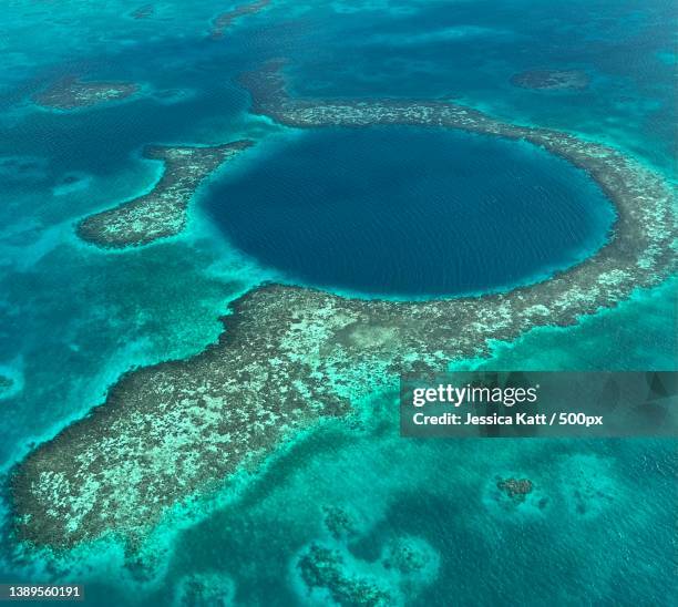 aerial view of island,lighthouse reef,belize - sinkhole foto e immagini stock