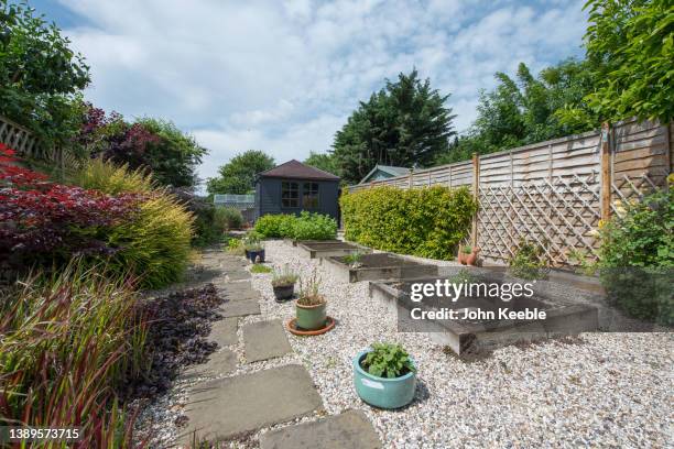 back garden exterior views - flower bed photos et images de collection