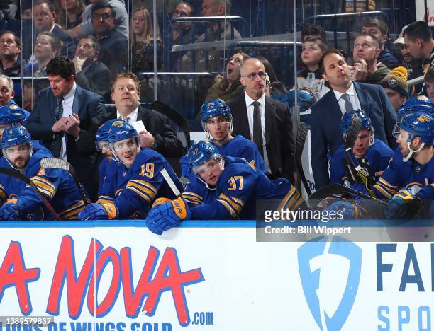 Assistant coaches Marty Wilford, Jason Christie, head coach Don Granato and assistant coach Matt Ellis of the Buffalo Sabres work the bench during an...