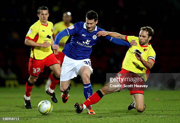 David Nugent of Leicester is tackled by John Eustace of Watford during the npower Championship match between Watford and Leicester City at Vicarage...