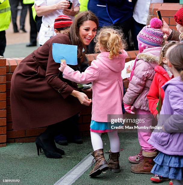 Catherine, Duchess of Cambridge greets a young girl during a walkabout as she visits Alder Hey Children's Hospital on February 14, 2012 in Liverpool,...