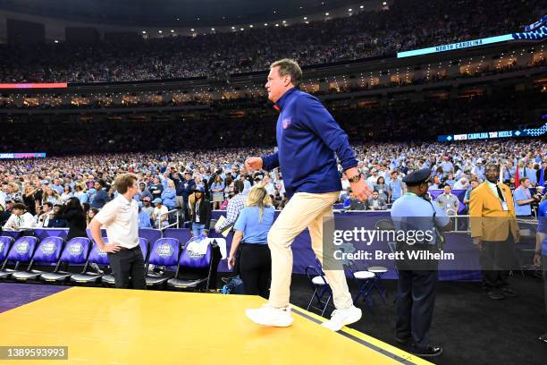 Head coach Bill Self of the Kansas Jayhawks walks onto the court against the North Carolina Tar Heels in the 2022 NCAA Men's Basketball Tournament...